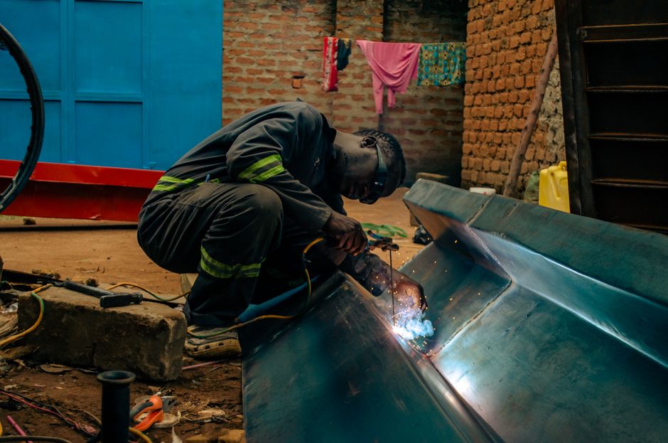 Skilled welder using arc welding technique in a busy metal workshop. (Photo: Shakur Leni / Pexels)