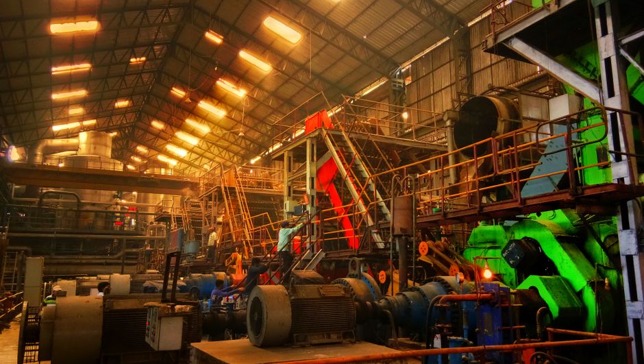 Detailed interior view of a bustling industrial factory in Ahmedabad, India. (Photo: Kalpesh Damor / Pexels)