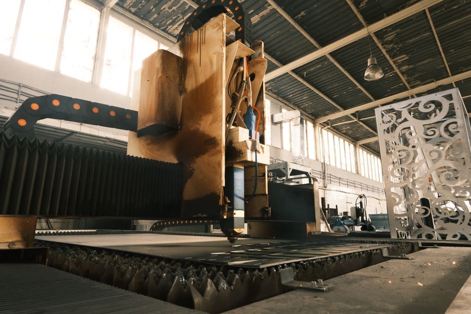 Close-up of a laser cutter in an industrial factory, showcasing modern manufacturing technology. (Photo: Cemrecan Yurtman / Pexels)