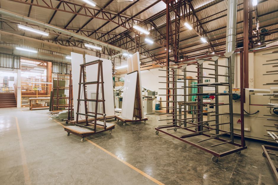 A large, well-lit industrial factory interior showcasing machinery and storage solutions. (Photo: Jhonny' Mages / Pexels)